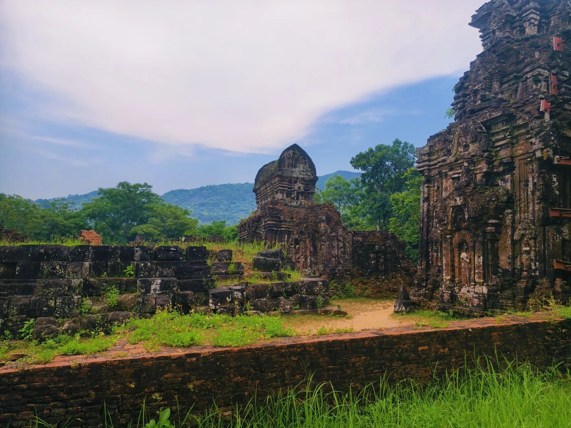 Ruins of the My Son temple complex in a valley among mountains